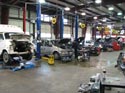7_Ford_van_Chrysler_minivan_in_repair_shop