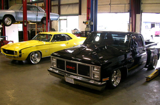 1969 Camaro RS SS and a custom GMC pickup truck in our shop bays.