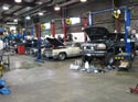6_Ford_pickup_Cadillac_GMC_in_repair_shop
